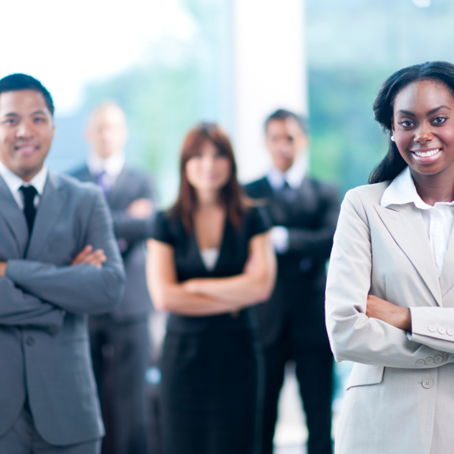 Business people standing with arms folded