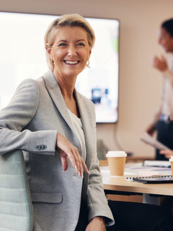 Business woman, portrait or leadership in office boardroom meeting, marketing workshop or advertising training goal. Smile, happy or mature corporate ceo in teamwork collaboration or diversity review