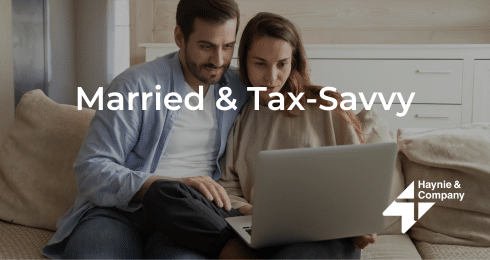 Couple using a laptop on a couch with Married & Tax-Savvy text overlay, Haynie logo.