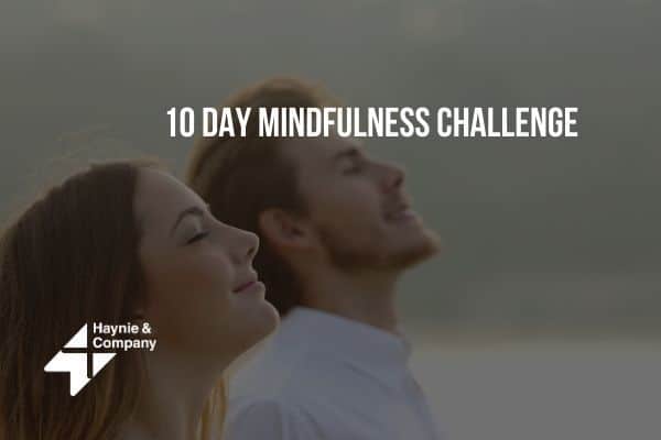 A woman and man practicing mindfulness outdoors with text 10 Day Mindfulness Challenge by Haynie.