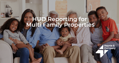 Family sitting on a couch with text HUD Reporting for Multi Family Properties by Haynie.