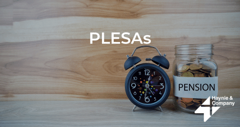 Clock and pension jar on wooden surface with PLESAs text and Haynie logo.