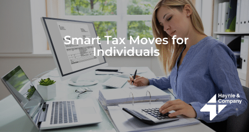 Woman working on taxes with a calculator and laptop, Smart Tax Moves for Individuals text displayed.