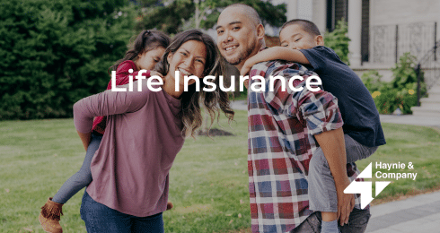 Family enjoying outdoors with children on their backs, promoting life insurance from Haynie.
