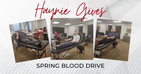 Haynie Gives Spring Blood Drive with people donating blood in an office setting.