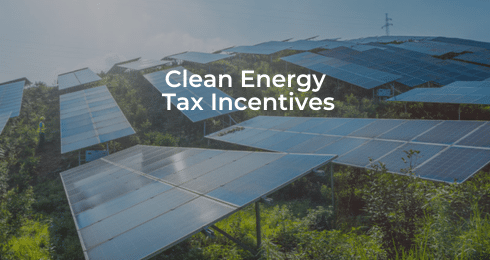 Solar panels in a field with text Clean Energy Tax Incentives overlay.