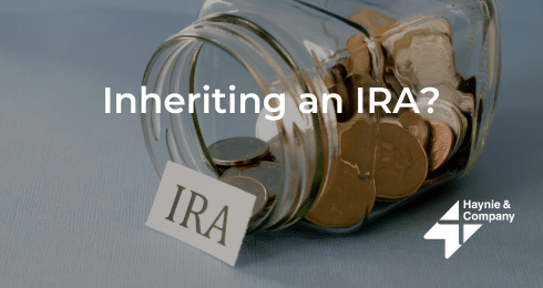 Inheriting an IRA? Coins in a jar with IRA label, Haynie logo.