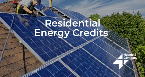 Solar panels on a roof with text Residential Energy Credits and Haynie logo.