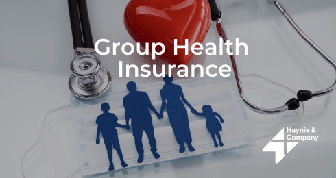 Group health insurance concept with family, stethoscope, mask, and heart.