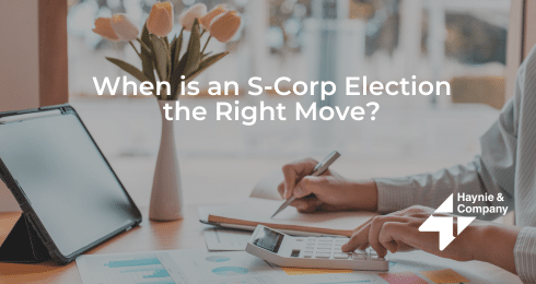 Person calculating with tablet and flowers, text reads When is an S-Corp Election the Right Move?