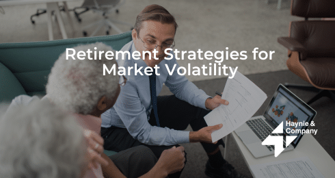Financial advisor discussing retirement strategies with senior couple.