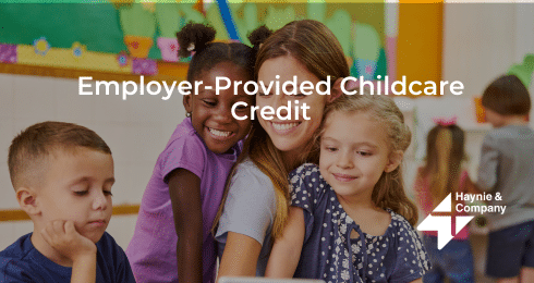 Employer-Provided Childcare Credit text with a group of diverse kids and an adult engaging in a classroom.