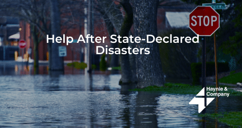 Flooded street with stop sign and text: Help After State-Declared Disasters by Haynie.