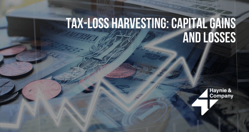 Tax-loss harvesting concept with currency, coins, and trending graph overlay.