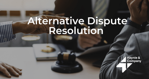 Alternative Dispute Resolution meeting with gavel on table, Haynie logo.