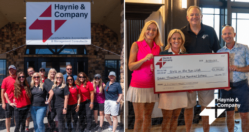 Haynie team posing and presenting a check for Girls on the Run Utah charity donation.