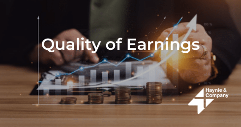 Quality of Earnings text overlay on financial graph and stacked coins.
