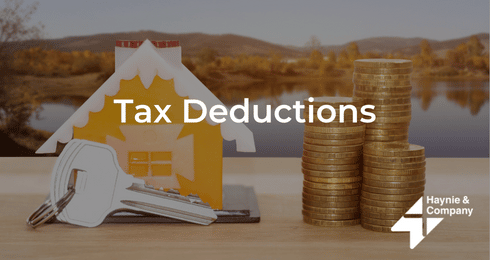 House model, keys, and stacked coins with text Tax Deductions and Haynie logo.