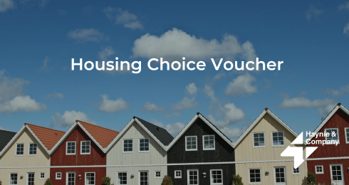 Row of colorful houses under blue sky with Housing Choice Voucher text. Haynie logo featured.