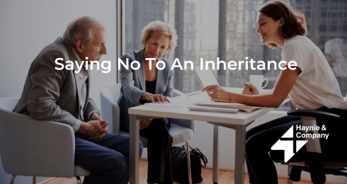 A discussion about refusing an inheritance, featuring two seated elders and a young woman with documents.