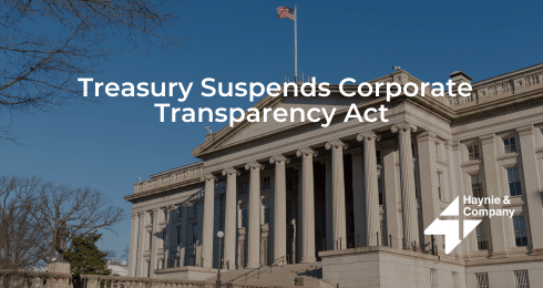 Treasury building with Treasury Suspends Corporate Transparency Act text overlay.