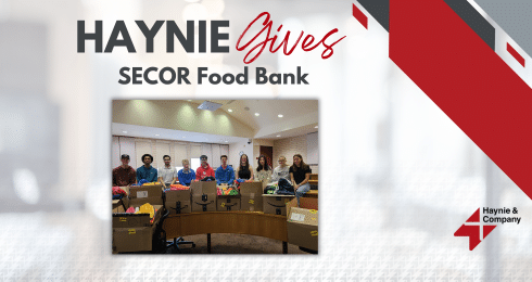 Group of people with donation boxes for SECOR Food Bank, Haynie Gives event.
