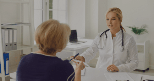 Doctor consulting with a patient in a modern medical office.
