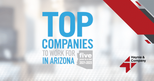Top Companies to Work for in Arizona 2021-2025, Haynie logo on blurred background.