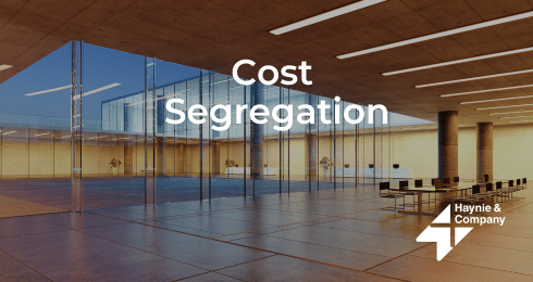 Cost Segregation text over modern office interior with Haynie logo.