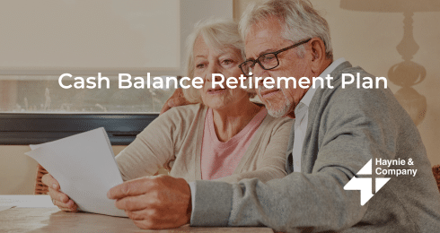 Elderly couple reviewing a Cash Balance Retirement Plan document at home.