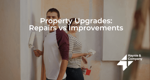 Couple painting walls for property upgrades, text: Property Upgrades: Repairs vs Improvements, Haynie logo.