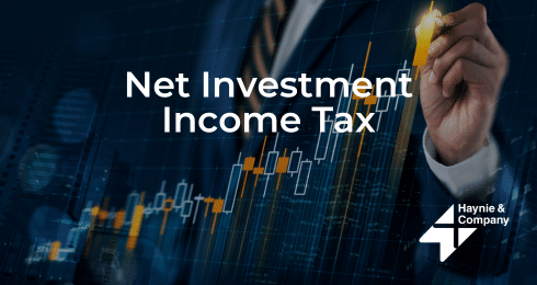 Net Investment Income Tax text with financial chart and person in suit holding pen.