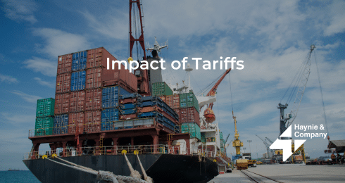 Cargo ship at port with containers, caption: Impact of Tariffs, by Haynie.