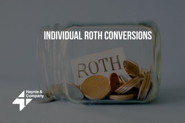 Jar of coins labeled Roth for individual Roth conversions by Haynie.