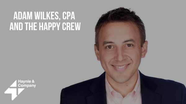 Adam Wilkes, CPA, smiling in a suit, with Haynie logo.