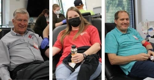 People donating blood at a clinic, seated in chairs, with donation equipment in view.