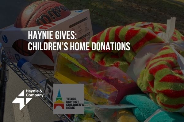 Haynie donates toys and gifts to Texas Baptist Children’s Home, including a basketball and plush items.