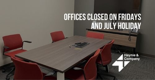 Office meeting room with red chairs, Haynie logo, and text about Friday and July holiday closures.