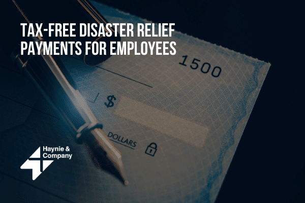 Tax-free disaster relief payments for employees promoted by Haynie, featuring a blank check and pen.