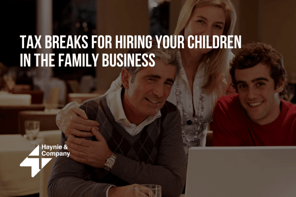 Family at a laptop discussing tax breaks for hiring children in the business, Haynie logo visible.
