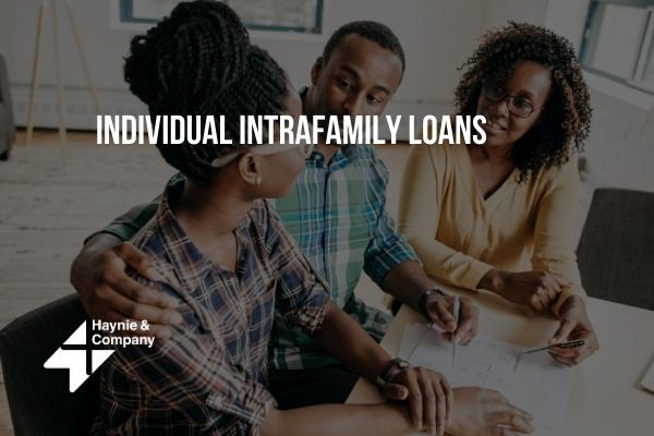 People discussing intrafamily loans at a table, Haynie logo visible.