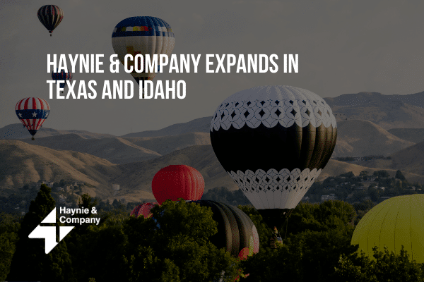Hot air balloons over landscape, text reads Haynie Expands in Texas and Idaho.