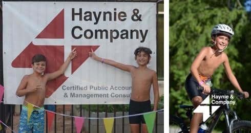 Two children point at Haynie sign; child smiling on bicycle.