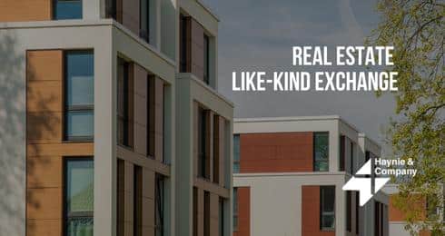 Modern buildings with Real Estate Like-Kind Exchange text by Haynie.