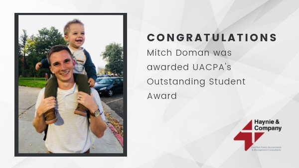 Mitch Doman receiving UACPA's Outstanding Student Award, smiling with a child on his shoulders.