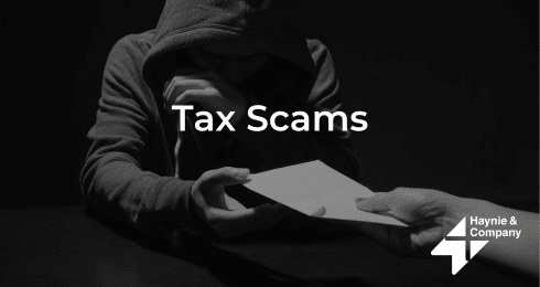 Hooded figure receiving envelope, text 'Tax Scams', Haynie logo.