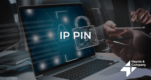 Laptop displaying IP PIN with security lock, Haynie branding.