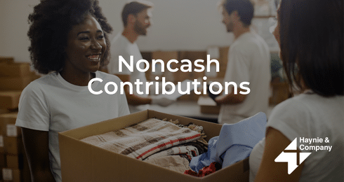 Noncash Contributions: Smiling woman holding a donation box with folded clothes, others in background, Haynie logo.