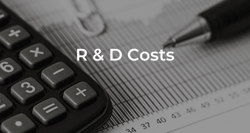 Calculator, pen, and graph overlayed with the text R & D Costs.