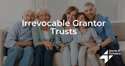 Family smiling on a couch, promoting irrevocable grantor trusts with Haynie logo.